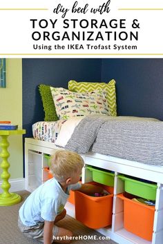 a boy playing with toy storage and organization using the ikea trofast system