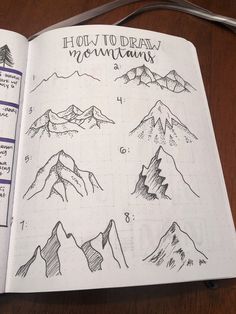 an open notebook with mountains drawn on it and some writing in the pages, along with instructions for how to draw mountain tops