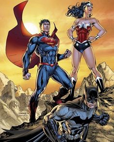 superman and wonder woman standing next to each other on top of a mountain with mountains in the background