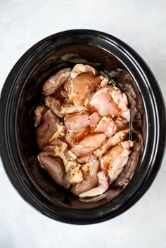 raw chicken in a slow cooker ready to cook