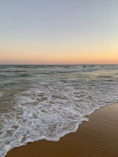 the ocean waves are coming in to shore