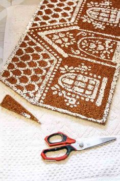 a pair of scissors sitting on top of a rug