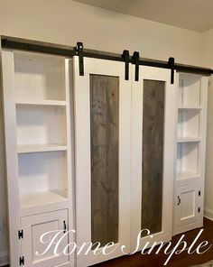 the interior of a home with white painted doors and open bookcases on either side