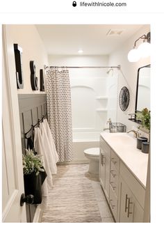 a bathroom with a shower, toilet and sink