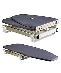 two metal beds with mattresses attached to them