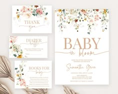 the floral baby shower suite is shown in gold and white, with flowers on it