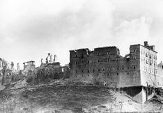 an old black and white photo of a castle