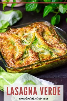 lasagna vegetable casserole in a glass dish with basil leaves around it