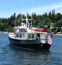 a black and white boat with an american flag on it