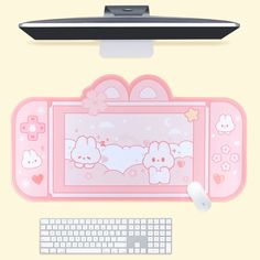 a pink hello kitty mouse pad next to a keyboard and monitor on a yellow background