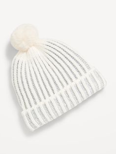 a white hat with a pom - pom on top