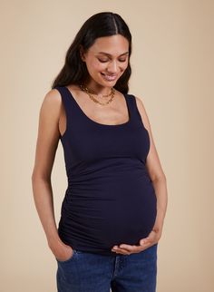 Description Modelled by 35 weeks pregnant Nicole Whether you wear it solo or layered under shirts and jackets, this eco-friendly maternity tank is a wardrobe hero. It is soft, stretchy and the built-in shelf bra will ensure you feel supported. It wears and washes brilliantly and its ruching detailing will grow with you during your pregnancy. Enjoy! Crafted in sustainable LENZING™ ECOVERO™ jersey Side seam ruching to ensure a flattering fit at all stages Built-in shelf bra for comfort and support Comfortable Stretch Nursing Bra For Maternity, Stretch Maternity Nursing Bra, Stretch Maternity Wear Nursing Bra, Stretchy Maternity Nursing Bra, Fitted Maternity Nursing Bra, Fitted Bump Friendly Nursing Bra For Maternity, Bump Friendly Sleeveless Tank Top, Fitted Bump Friendly Maternity Tops, Fitted Maternity Tops Bump Friendly