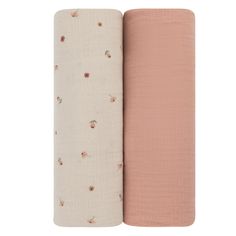 two pink and white blankets are next to each other on a white background, one is folded