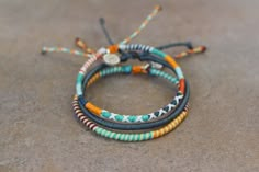 Includes 3 bracelets 1 dark blue wrap bracelet 2 multicolor wrap bracelets Adjustable from 15cm String Bracelet Patterns, Cute Friendship Bracelets, Embroidery Bracelets, Friendship Bracelets Designs, Diy Friendship Bracelets Patterns, Bracelet Couple, Diy Bracelets Patterns, Diy Bracelet Designs, Bead Ideas