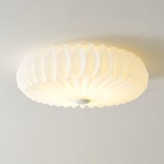 a white ceiling light hanging from the ceiling