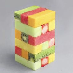 the fruit cubes are made up of slices of melon, kiwi, and pineapple