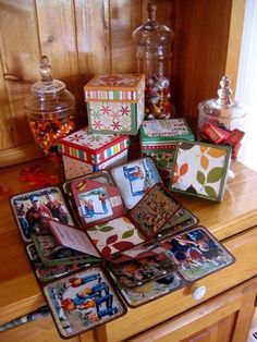 there are many small boxes on the counter top with candy and candies in them