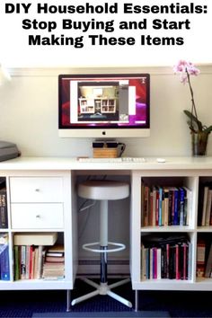 a desk with a computer on top of it and some books in front of it