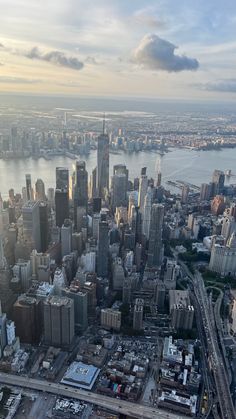 an aerial view of a large city with lots of tall buildings in the foreground