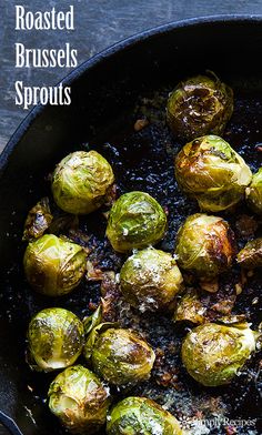 roasted brussel sprouts in a cast iron skillet with text overlay