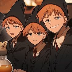 three young boys dressed up in witches hats and holding a glass jar with liquid inside