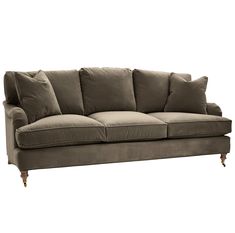 a gray couch with pillows on top of it