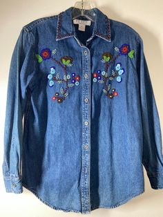 "Good fade - labeled sz P (Petit) Pit to pit 18\" / pit to wrist 18 1/2\"/ length (shoulder to bottom) 27\" / smoke free environment / No issues (88)" Fitted Vintage Button-up Denim Top, Vintage Blue Embroidered Blouse, Vintage Denim Blue Button-up Top, Vintage Embroidered Fall Shirt, Vintage Blue Embroidered Top, Vintage Denim Blue Shirt For Spring, Vintage Denim Blue Top For Spring, Vintage Beaded Tops For Summer, Vintage Embroidered Denim Blue Tops