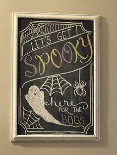 a chalkboard with the words let's get spooky on it