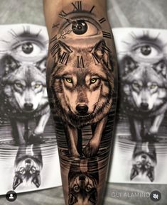 a man's leg with tattoos on it and two wolfs in the background