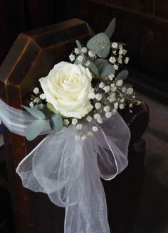 a white rose and some baby's breath flowers