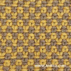 close up view of the crochet stitchs in yellow and grey yarn,