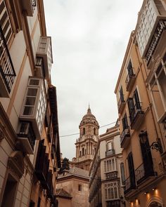 an old building is seen through the narrow streets