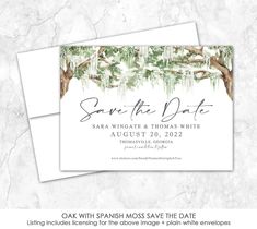 save the date card with an image of trees and moss on it in white marble