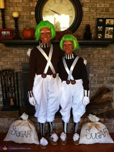 two people dressed in costumes standing next to each other