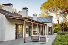 an outdoor patio area with chairs and tables