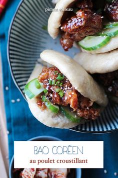 three pita breads with meat, cucumber and sauce on them sitting on a plate