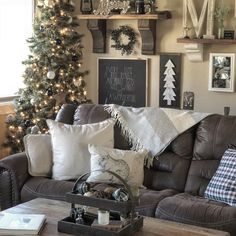 a living room filled with furniture and a christmas tree