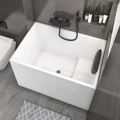 a bathroom with a sink, toilet and bathtub that is in the middle of the floor