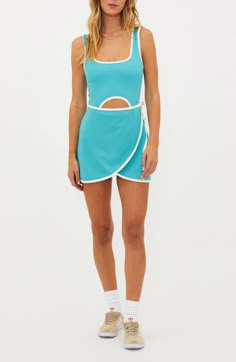 Court attention in this flirty tennis dress that serves up utility along with eye-catching looks thanks to a front cutout, padded shelf bra and inner shorts. Pull-on style Square neck Sleeveless Built-in shorts with drop-in pockets 78% polyester, 22% spandex Machine wash, tumble dry Imported Sporty Fitted Tennis Skirt For Day Out, Summer Blue Mini Tennis Dress, Mini Tennis Dress With Built-in Shorts, Summer Dresses With Built-in Shorts, Mini Length, Summer Dresses With Built-in Shorts And Mini Length, Blue Tennis Skort For Summer, Summer Sports Mini Dress With Built-in Bra, Summer Tennis Dress With Built-in Shorts, Short Tennis Dress For Summer