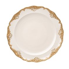 an empty white plate with gold trimmings