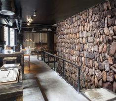 there is a stone wall in the restaurant