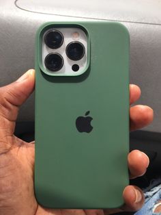 someone holding an iphone in their hand with the back cover removed from it's case