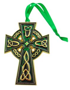 a cross ornament hanging from a green ribbon