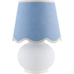 a white table lamp with a blue shade