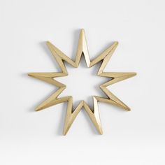 an image of a star made out of gold colored metal pieces on a white background