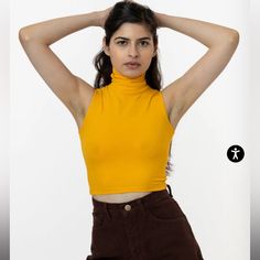 Los Angeles Apparel Turtleneck Sleeveless Crop Top Xs In Mustard Trendy Sleeveless Crop Top, Yellow Sleeveless Vest Top, Fitted Yellow Halter Top Casual, Fitted Yellow Halter Top, Yellow Stretch Cropped Tank Top, Yellow Stretch Crop Top Tank, Yellow Sleeveless Crop Top, Yellow Stretch Vest, Trendy Yellow Vest Top