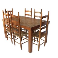 a wooden table and six chairs with one chair up against the other, in front of a white background