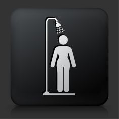 a black square button with a man under a shower