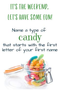 a glass jar filled with candy on top of a white table next to a sign that says, it's the weekend let's have some fun