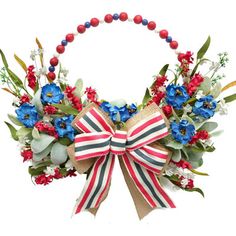 a red, white and blue wreath with flowers